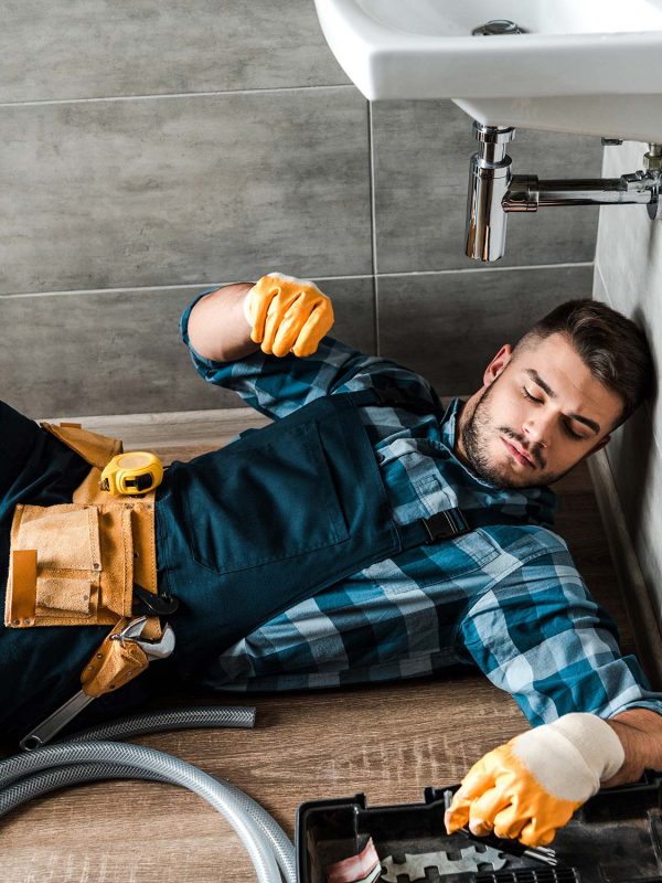 bearded-handyman-lying-on-floor-near-toolbox-in-ba-resize.jpg